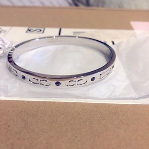 Silver with studs and Coach Logo all around